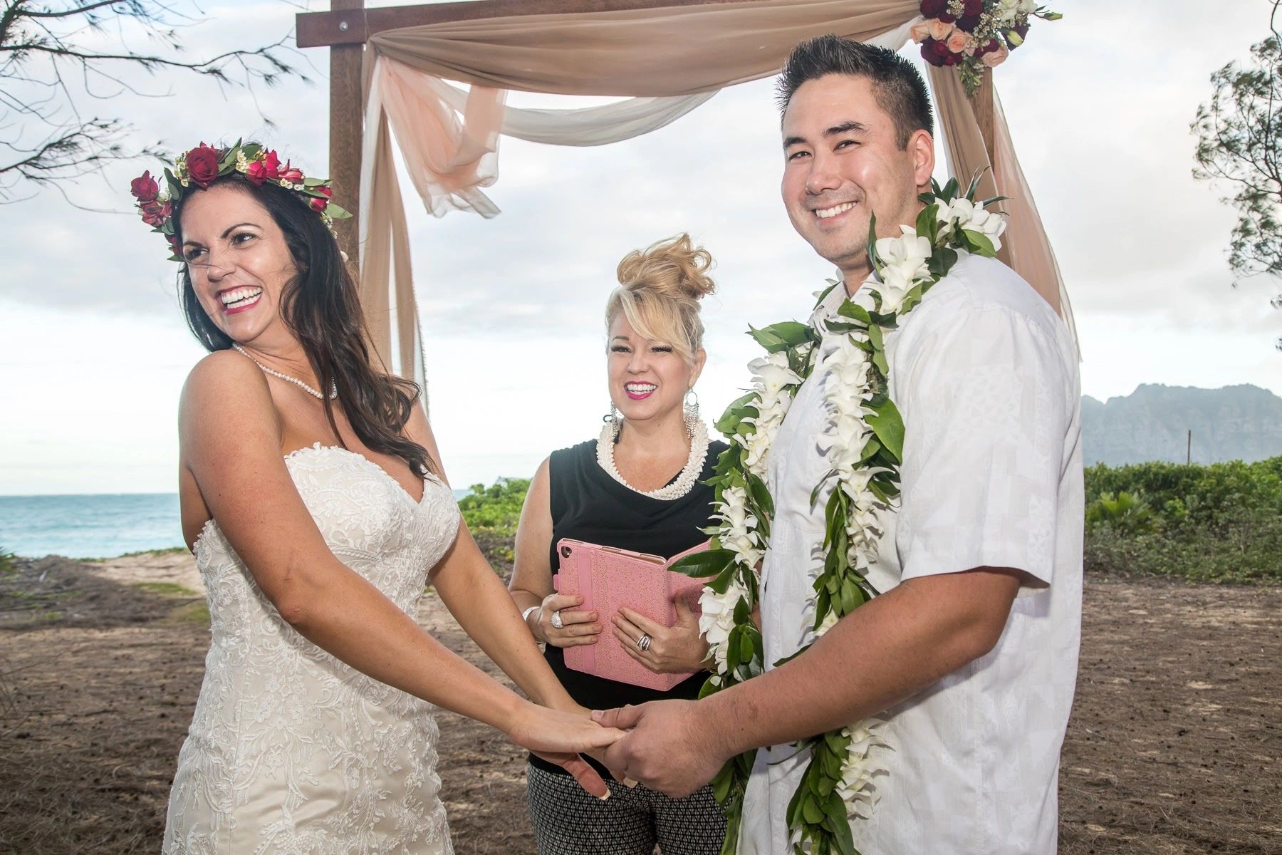Wedding ceremony arch beach Hawaii officiant